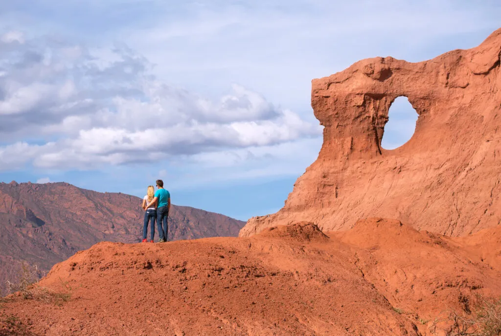 Couple walking in salta landscape 