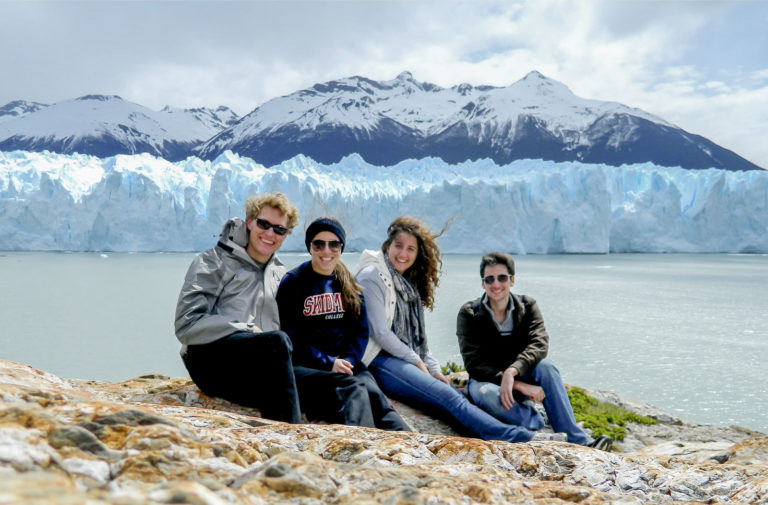 Group in el calafate with perito moreno glacier in the back