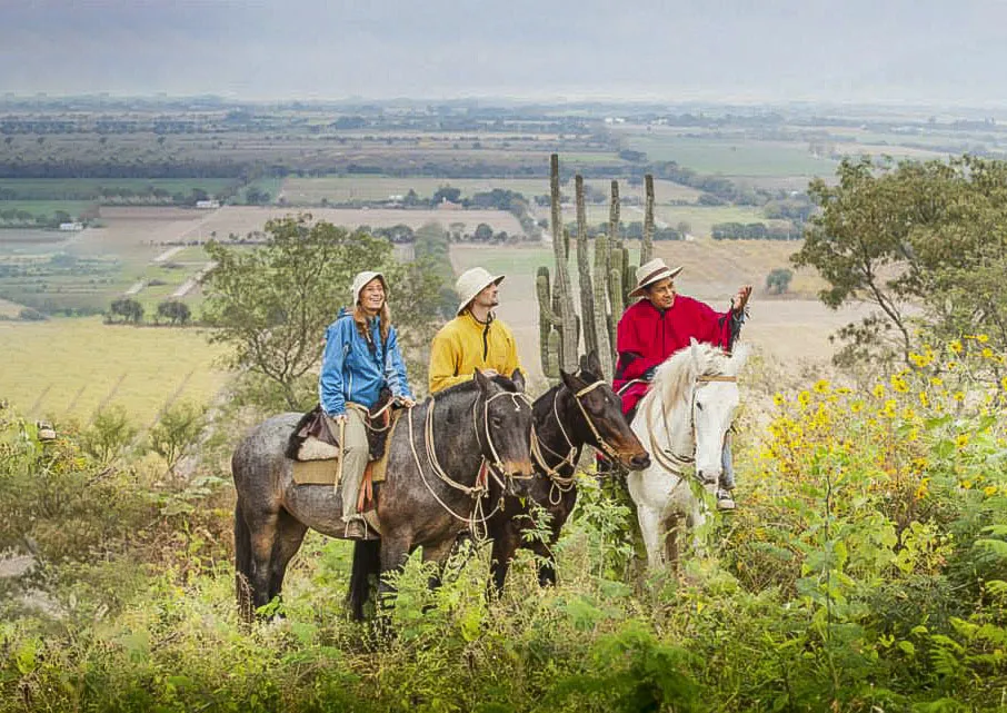 a couple riding horses in Salta with guide