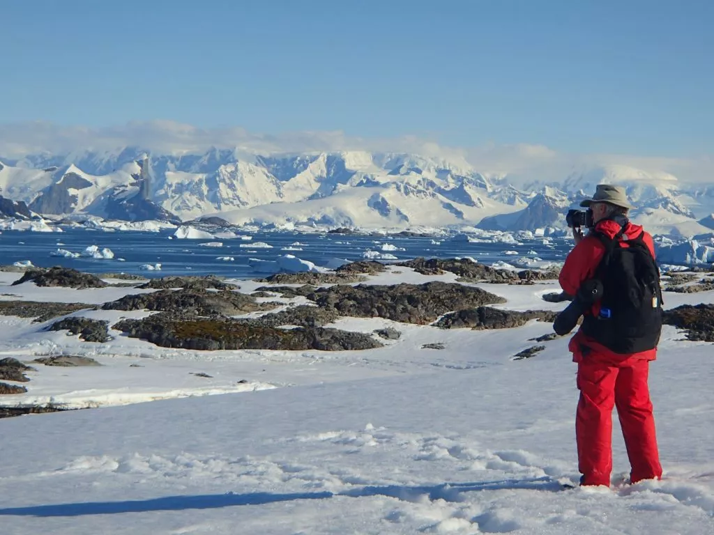 Traveler admiring the Antarctic Pen&iacute;nsula.