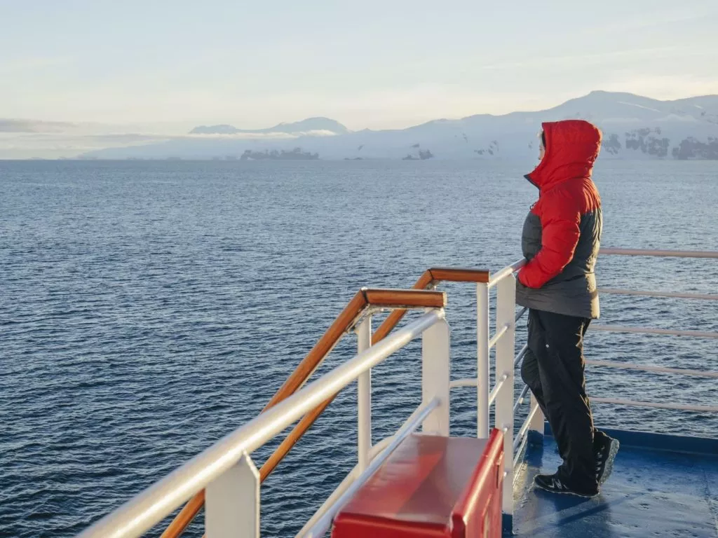 A passenger looking at the landscape of Antarctica