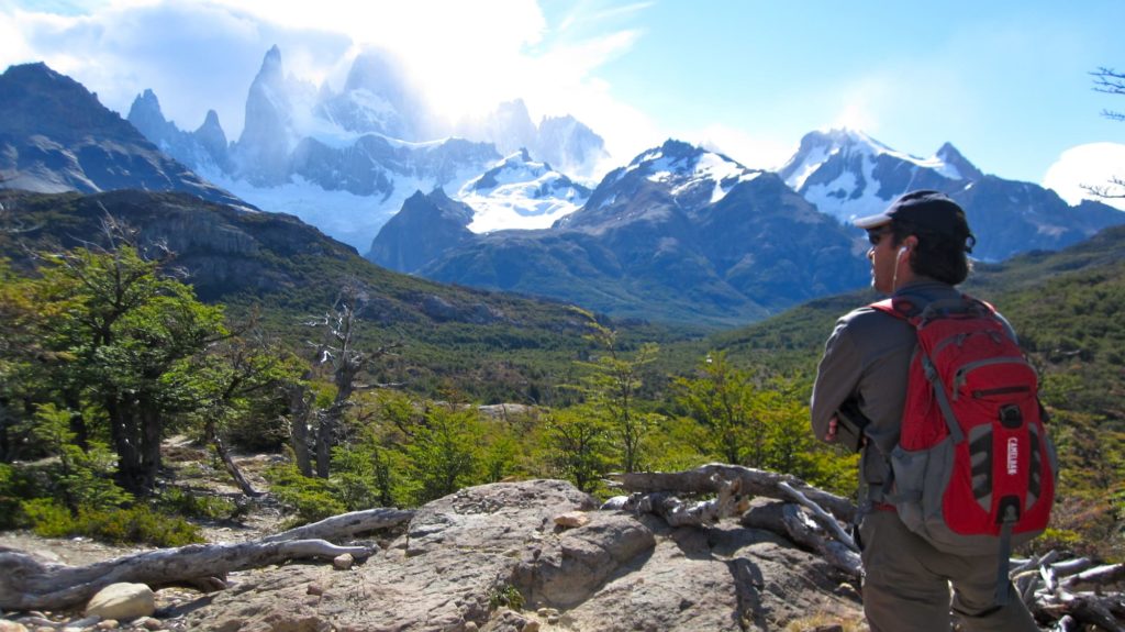 Man regarding the Mount Fitz Roy.