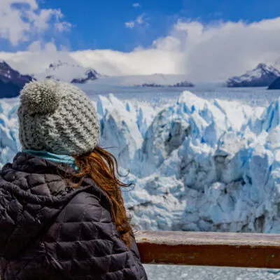 Woman looking to the Perito Moreno Glacier in El Calafate.