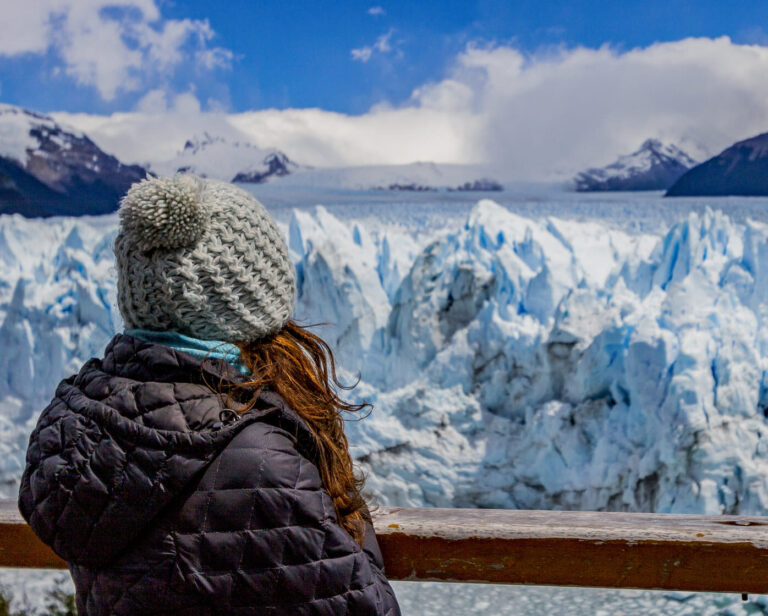 Woman looking to the Perito Moreno Glacier in El Calafate.