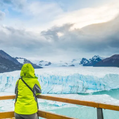 A guy looking at perito moreno glacier