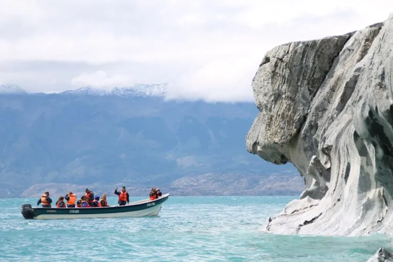 Marvel caves chile A group of peolple in a boat exploring the marvel caves
