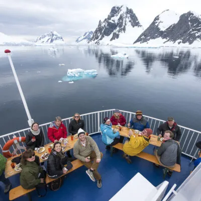 A group of clientes celebrating in Antarctica cruise 
