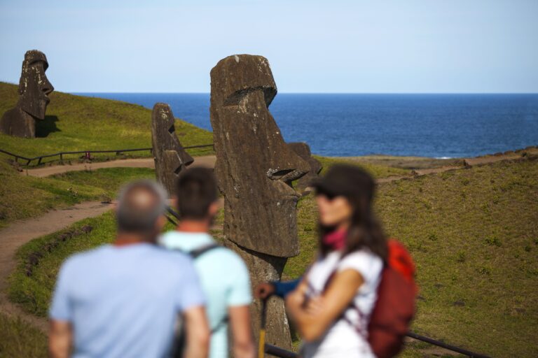 people hiking in rano kau easter island
