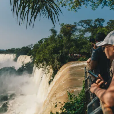 Girl looking at iguazu falls