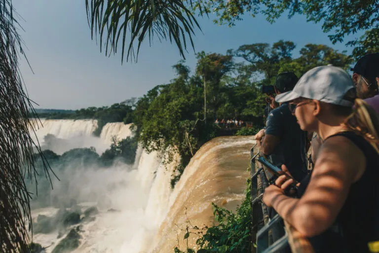 Girl looking at iguazu falls