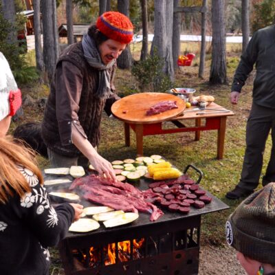 Group of tourist cooking with Lucas Mallman in Bariloche
