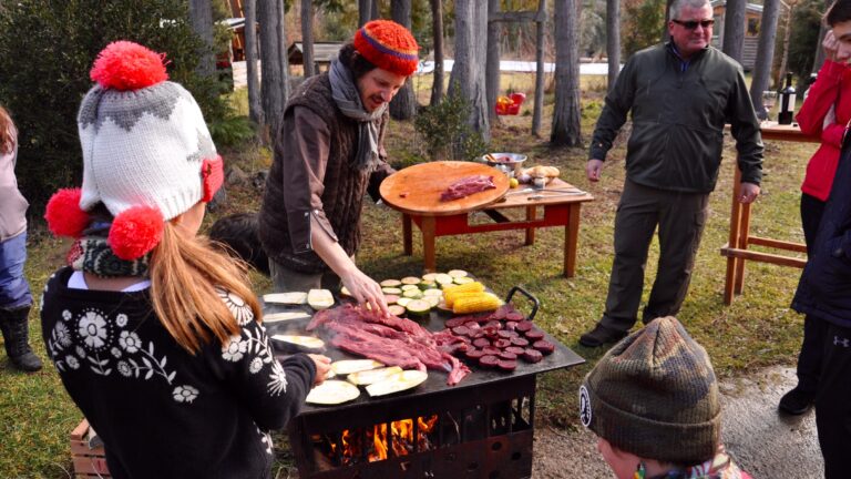 Group of tourist cooking with Lucas Mallman in Bariloche