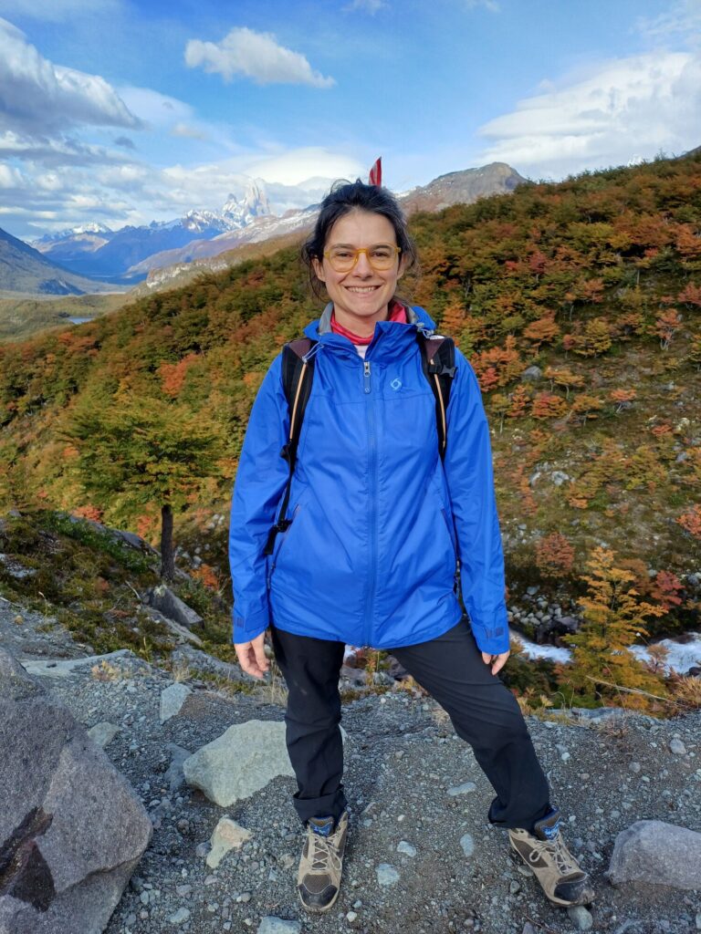 Me, at the summit, with Mount FItz Roy as backdrop in El Chaltén, Patagonia, Argentina.
